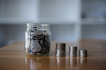 stack of silver coins, saving money for financial investment concept.
