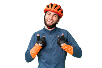 Young cyclist man over isolated chroma key background with surprise facial expression