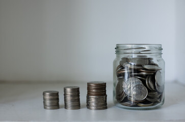 stack of silver coins, saving money for financial investment concept.
