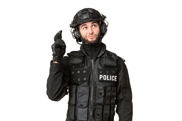 Fototapeta premium SWAT over isolated chroma key background with fingers crossing and wishing the best