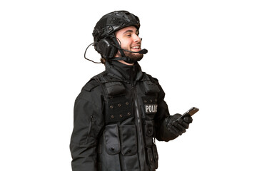 SWAT over isolated chroma key background keeping a conversation with the mobile phone with someone