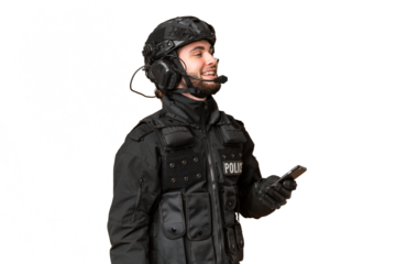 SWAT over isolated chroma key background keeping a conversation with the mobile phone with someone