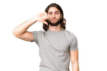 Young handsome man over isolated chroma key background showing thumb down with negative expression