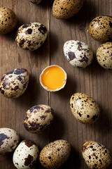 Fototapeta premium Quail eggs on a wooden table.