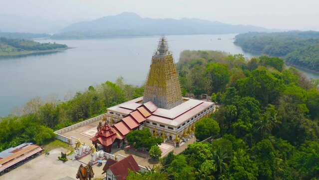 Phuthakaya Temple Pagoda, Sangklaburi Kanchanaburi Attractions. Singha in front of temple Bodhgaya Stupa.Thai architecture. Landmark