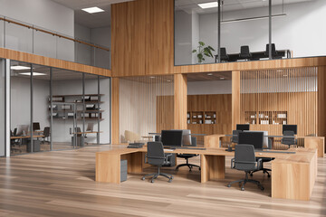 Light office interior with coworking and conference area behind glass doors