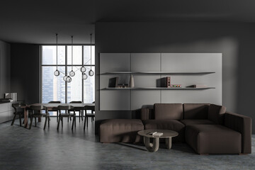 Front view on dark studio room interior with sofa