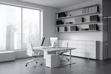Modern office interior with pc computer and shelf, window on skyscrapers