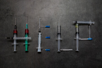 Syringes. The word help is laid out from used syringes. The concept of drug dependence, drug use, drug rehabilitation