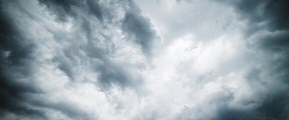 Dramatic cloudscape texture. Dark heavy thunderstorm clouds before rain. Overcast rainy bad weather. Storm warning. Natural gray background of cumulonimbus. Nature backdrop of stormy cloudy sky.