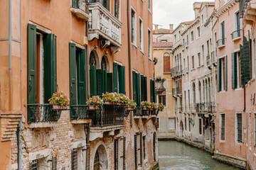 Flowers on balconies overlooking the canal in Venice