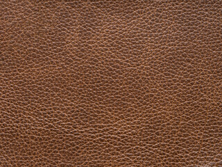 Beige or light brown color leather skin natural with design lines pattern or abstract background. Can use as wallpaper or backdrop luxury event. Genuine leather texture. Faux eco leather.