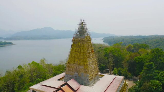Phuthakaya Temple Pagoda, Sangklaburi Kanchanaburi Attractions. Singha in front of temple Bodhgaya Stupa.Thai architecture. Landmark