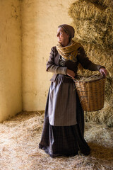 Peasant woman with hay basket