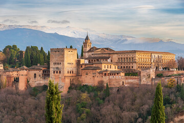 Fototapeta na wymiar Palace of Carlos V in the Arab complex of the Alhambra in Granada, with Sierra Nevada in the background, with daylight.