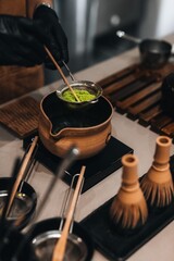 Japanese Matcha green tea making process. Traditional utensils made from natural organic materials....