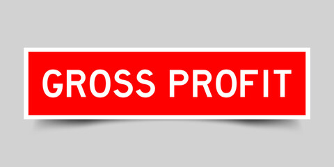 Sticker label with word gross profit in red color on gray background