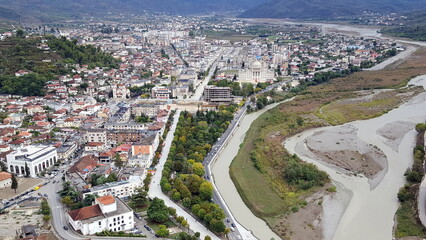 Berat is a city on the Osum River in central Albania. It is famous for the white Ottoman houses and for the castle of Berat, a huge complex on the hill where some citizens now reside. inside its walls