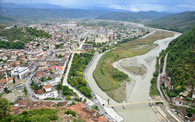 Berat is a city on the Osum River in central Albania. It is famous for the white Ottoman houses and for the castle of Berat, a huge complex on the hill where some citizens now reside. inside its walls