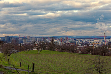 Scenic view over City of Z&uuml;rich North with skyline and dramatic sky on a winter evening. Photo taken February 4th, 2023, Zurich, Switzerland.