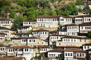 Berat is a city on the Osum River in central Albania. It is famous for the white Ottoman houses and for the castle of Berat, a huge complex on the hill where some citizens now reside. inside its walls