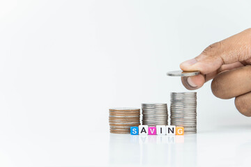 hand putting a coin on stacks of coin, money saving concept, financial and business growth concept, white background, copy space.