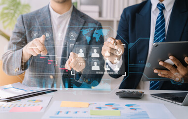 Business team hand Project manager working and update tasks and Gantt chart scheduling virtual diagram with tablet and laptop in office.