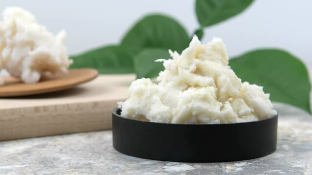 Shea butter on light background, unrefined, close up	