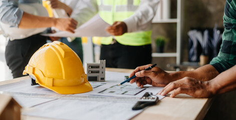 Business people having consultation about wind energy at company office. Asian industry professional team.