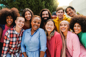 Multiethnic diverse group of people having fun outdoor - Diversity lifestyle concept - Main focus on Asian girl face