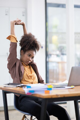 Young African American businesswoman working with pile of documents at office workplace,  feeling sick at work, stress from work, overworked, problem, unhappy.	