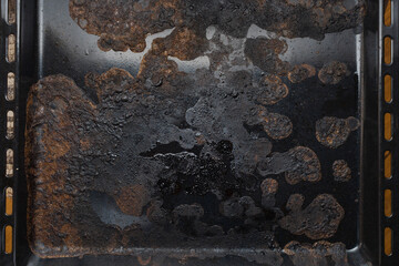 dirty oven baking tray at kitchen, black old baking sheet,  top view