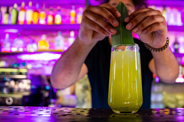 bartender making lemonade in a nightclub bar