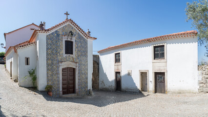 Fototapeta na wymiar Exterior view facade of the Chapel of Nossa Senhora da Conceição, an 18th-century Mannerist baroque building, inside the Castle and Palace of the Condes de Ourém