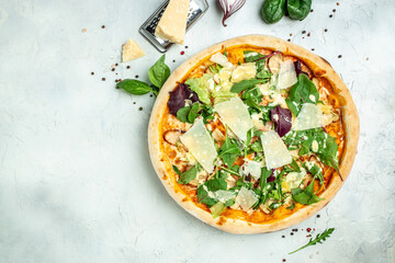 Delicious pizza Caesar with chicken, cheese and lettuce. on a light background. Restaurant menu, dieting, cookbook recipe top view
