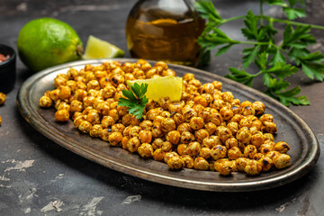 Fried roasted spicy chickpeas or Indian chana or chole with lime. Tasty vegetarian and vegan chickpea snack. banner, menu, recipe place for text, top view