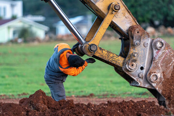 Fototapeta premium Excavator maintenance and repair operator doing repairs and maintenance
