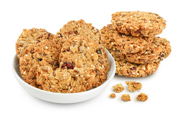 Granola cookie in ceramic bowl isolated on white background with full depth of field