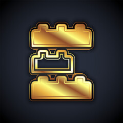 Gold Toy building block bricks for children icon isolated on black background. Vector