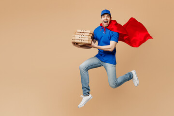 Full body delivery guy employee man wear blue cap t-shirt uniform workwear super hero red coat work...