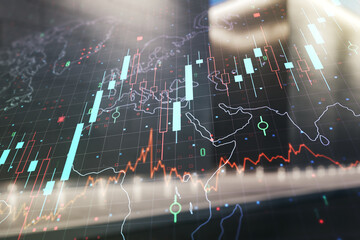 Multi exposure of virtual abstract financial chart hologram and world map on modern business center exterior background, research and analytics concept