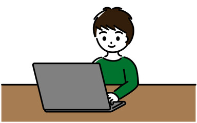 笑顔でノートパソコンを操作する小学生の男の子