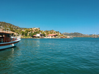 View of Kayakoy Kekova Simena village. Sunken city of Kekova in bay of Ucagiz view from sea in Antalya province of Turkey	