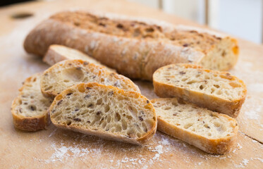fresh loaf of bread on wooden board