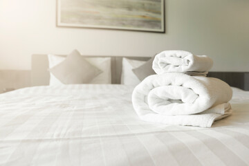 Fototapeta na wymiar The White towel on bed decoration in bedroom interior - Vintage light Filter