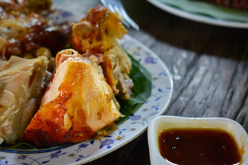 Papaya salad and grilled chicken is a popular dish in Asia.