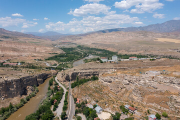 Fototapeta premium Kemah district city entrance. View of Sultan Melik Tomb and Karasu River.