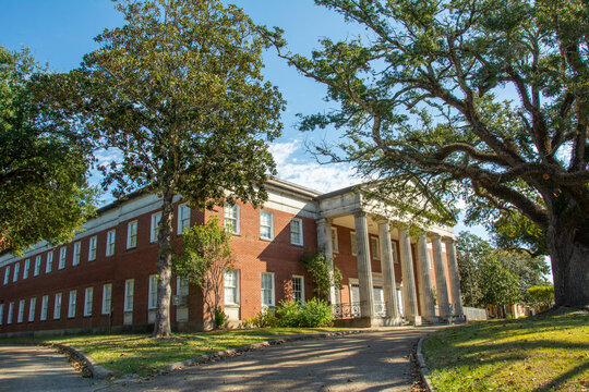 Natchez, USA &ndash; December 2, 2022 - Natchez City Auditorium with a broad, hexastyle pedimented Doric portico in On Top of the Hill Historic District of Natchez, Adams County, Mississippi