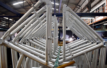 Industrial worker doing welding of a bicycle manufacturing industry