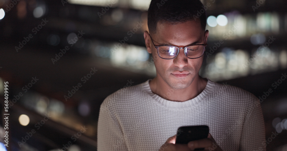 Poster business man, phone and night data while online on an urban building rooftop typing email, search or